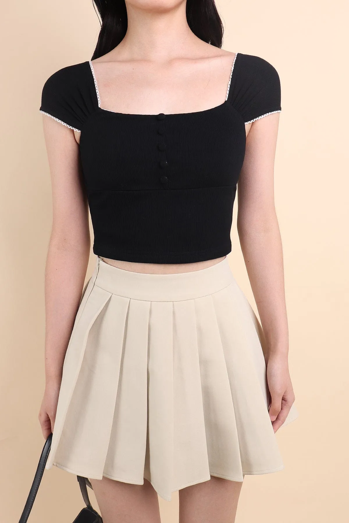 CAMU PLEATED SKIRT IN ECRU